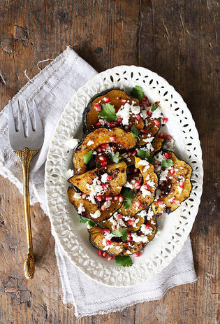  Herb-Roasted Acorn Squash with Queso Fresco and Pomegranate